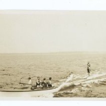 04.10a 1930, man skiing with woman on shoulders